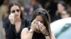 Mourners cry as they leave the funeral service for Anthony Luis Laureano Disla, one of the victims of the Pulse nightclub mass shooting, in Orlando, Florida, June 17, 2016.
