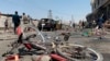 A damaged bicycle is seen at the site of a suicide attack in Kabul, Afghanistan, July 25, 2019. Afghan police say a suicide bomber blew himself up Thursday in front of a bus carrying Ministry of Mines employees.