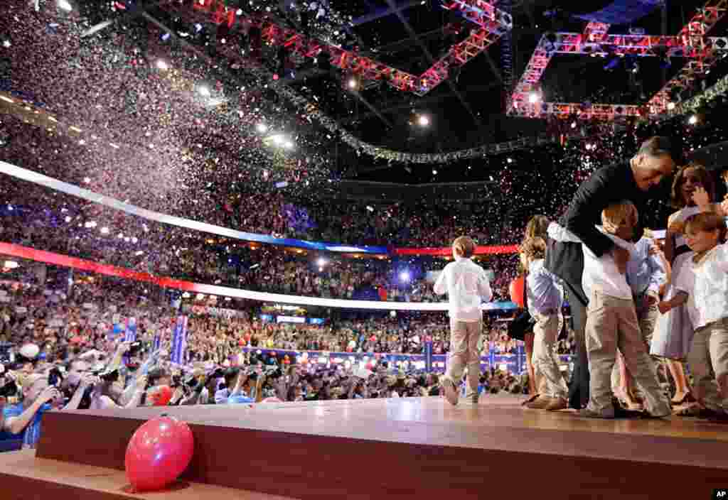 Mitt Romney hugs his grandchildren after his speech, August 30, 2012.