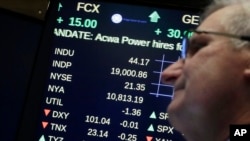A board above the trading floor of the New York Stock Exchange shows the Dow Jones industrial average above 19,000 for the first time, Nov. 22, 2016. Stocks have mostly rallied since the Nov. 8 election, ending the day at 19,023.87.