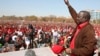 Leader of Zimbabwe's opposition party Movement For Democratic Change (MDC) Prime Minister Morgan Tsvangirai greets supporters at a rally in Harare, July 29, 2013.