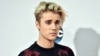 Justin Bieber arrives at the American Music Awards at the Microsoft Theater, Nov. 22, 2015, in Los Angeles. 