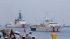 FILE - The U.S. Coast Guard National Security Cutter Bertholf (WMSL 750), left, and the Philippine Coast Guard ship BRP Batangas arrive, May 15, 2019, in Manila, Philippines, after taking part in a joint exercise off the South China Sea.
