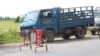Trucks carrying passengers into Phnom Penh, where the opposition Cambodia National Rescue Party holds protests, were stopped at this road block, September 07, 2013.