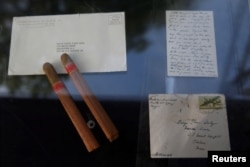 Memorabilia to be auctioned by Guernsey's as part of the 'John and Jackie Kennedy Pieces' in honor of what would have been JFK's 100th birthday are seen outside the Loeb Boathouse at Central Park in New York, Sept. 26, 2017.