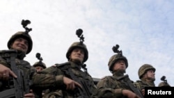 Польські солдати беруть участь у спільних військових навчаннях польських збройних сил і НАТО «Анаконда-2014» на військовому полігоні в Oжиші, 2 жовтня 2014 року