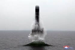 What appears to be a submarine-launched ballistic missile (SLBM) flies at an undisclosed location in this undated photo released by North Korea's Central News Agency (KCNA), Oct. 2, 2019.
