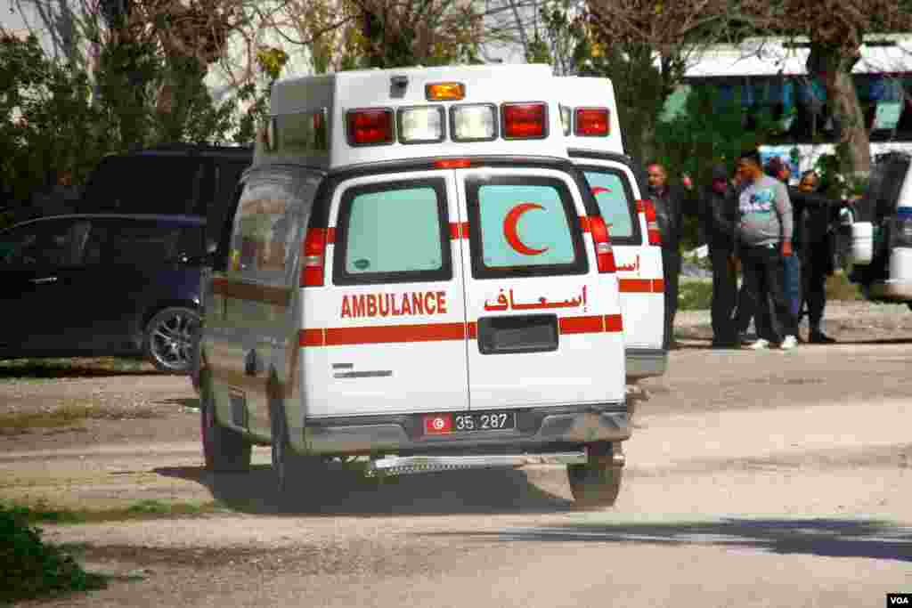 An ambulance and other emergency services vehicles stand the scene of an attack targeting tourists at the National Bardo Museum, Tunis, March 18, 2015. (Mohamed Krit/VOA)