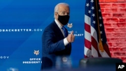 President-elect Joe Biden departs a news conference after introducing his nominees and appointees to economic policy posts at The Queen theater, Tuesday, Dec. 1, 2020, in Wilmington, Del. (AP Photo/Andrew Harnik)