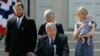 FILE - Rep. Dennis Hastert announces that he will not seek re-election to the U.S. House as he stands on the steps of the old Kendall County, Ill., courthouse with family members, Aug. 17, 2007.
