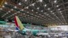 ARCHIVO - Empleados de Boeing trabajan en el 737 MAX en la planta de Boeing, en Renton, Washington. (Ellen M. Banner/The Seattle Times vía AP)