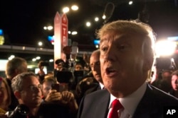 Republican presidential candidate Donald Trump speaks to the media in the spin room after the first Republican presidential debate at the Quicken Loans Arena Thursday, Aug. 6, 2015.