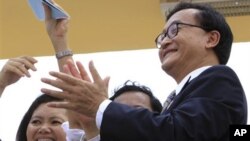 Sam Rainsy lives in exile, facing criminal charges he says are politically motivated and are preventing his return to the country. 