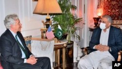 In this photo released by Inter Services Public Relations, visiting CIA Director William Burns, left, meets with Pakistan's Army Chief Gen. Qamar Javed Bajwa, in Rawalpindi, Pakistan, Sept. 9, 2021.