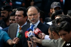 FILE - Pakistani Interior Minister Ahsan Iqbal talks to media in Islamabad, Pakistan, Oct. 2, 2017.