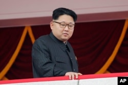 FILE - North Korea's leader Kim Jong Un watches a parade in Pyongyang, May 10, 2016.