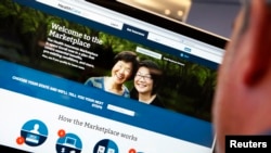 FILE - A man looks over the Affordable Care Act (commonly known as Obamacare) signup page on the HealthCare.gov website in New York in this photo illustration.