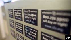 Cabinet magnets at the Alzheimer's Association Headquarters advertise the group's help line, Chicago, Illinois, June 21, 2013.