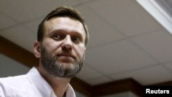 FILE - Russian anti-corruption campaigner and prominent opposition figure Alexei Navalny is seen attending a hearing at the Moscow City Court in Moscow, Feb. 12, 2016. His conviction on an embezzling charge has been overturned.