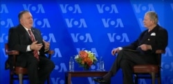 Secretary of State Michael Pompeo has a conversation with VOA Director Robert Reilly at the Voice of America headquarters in Washington, Jan. 11, 2021.