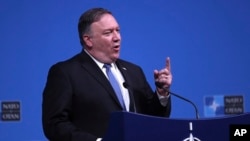 U.S. Secretary of State Mike Pompeo speaks during a media conference after a meeting of NATO foreign ministers at NATO headquarters in Brussels, Dec. 4, 2018. 