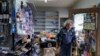 Kenny Ransbottom walks through debris inside his auto parts store after an earthquake in Rio Dell, California, Dec. 20, 2022. 