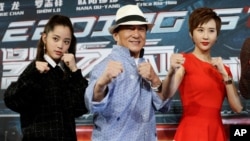 Actor Jackie Chan (C) poses with Nana Ou-Yang (L) and Erica Xia-Hou at the announcement of the beginning of production for the sci-fi action film 'Bleeding Steel', billed by producers as the biggest budget Chinese film ever shot in Australia, in Sydney, Australia July 28, 2016.