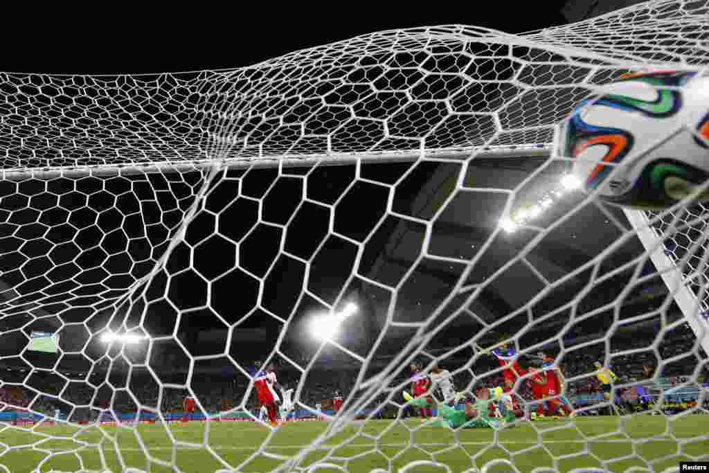 Ghana's Andre Ayew scores a goal during their 2014 World Cup Group G soccer match at the Dunas arena in Natal, June 16, 2014.