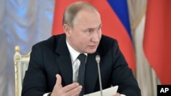 Russian President Vladimir Putin speaks at meeting with cultural advisers in St. Petersburg, Russia, Dec. 15, 2018. Alarmed by the growing popularity of rap among Russian youth, Putin wants cultural leaders to devise a means of controlling popular music.