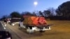 Trucks carrying medicine, rice and powdered milk, part of a more than 200-ton combined shipment of U.S. and Brazilian aid, head from Boa Vista, Brazil, into southern Venezuela, Feb 23, 2019.