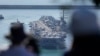 FILE - The nuclear-powered aircraft carrier USS Ronald Reagan is escorted as it arrives in Busan, South Korea, Sept. 23, 2022.