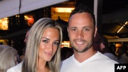 Olympian sprinter Oscar Pistorius posing next to his girlfriend Reeva Steenkamp at Melrose Arch in Johannesburg, Jan. 26, 2013.