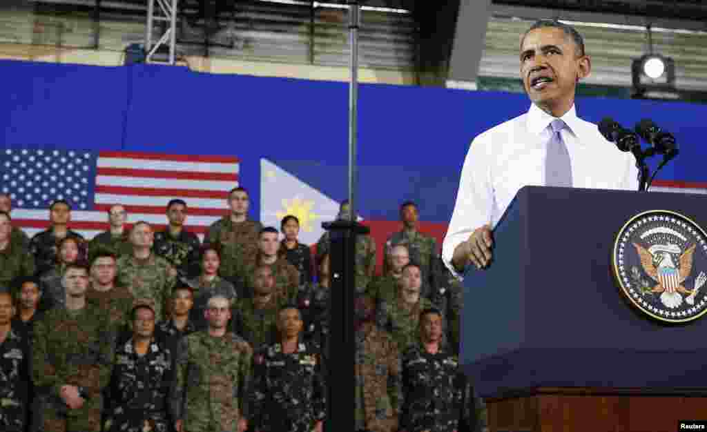 President Barack Obama speaks to military troops at Fort Bonifacio, saying a new military pact signed with the Philippines on Monday, April 27 granting a larger presence for U.S. forces would bolster the region's maritime security, Manila, April 29, 2014.