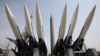Models of a mock North Korea Scud-B missile, center, and other South Korean missiles are displayed at Korea War Memorial Museum in Seoul, South Korea, March 17, 2013. 