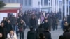 Pedestrians brave the cold, Jan. 30, 2020, in Pyongyang, North Korea. In an interview, North Korea's Ministry of Health Director Kim Dong Gu says the country is intensifying efforts to prevent the spread of a new virus from China.