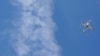 FILE - Increasingly, drones are being used to monitor weather patterns and help map out contours of the land.