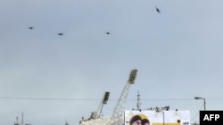 TOPSHOT - Israeli Air Force F-15 and F-35 fighter aircraft fly over Camille Chamoun Sports City Stadium on the outskirts of Beirut on February 23, 2025 during the funeral of slain Hezbollah leaders Hassan Nasrallah and Hashem Safieddine.TOPSHOT - Israeli Air Force F-15 and F-35 fighter aircraft fly over Camille Chamoun Sports City Stadium on 