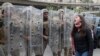 A protester shouts slogans in front of army soldiers during a protest against a parliament session vote of confidence for the new government in downtown Beirut, Lebanon, Feb. 11, 2020. 