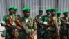 FILE - The first Rwandan soldiers who are part of the African Union peacekeeping force in the Central African Republic (MISCA) prepare to receive a welcome speech by their superiors shortly after landing at the airport of the capital Bangui.