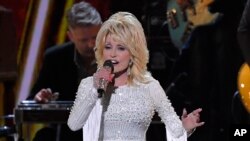 FILE - This Nov. 13, 2019, file photo shows Dolly Parton performing at the 53rd annual CMA Awards in Nashville, Tennessee. 