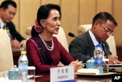 Myanmar's State Counselor Aung San Suu Kyi hold a talk with Chinese President Xi Jinping, at the Diaoyutai State Guesthouse in Beijing, China, August 19, 2016.