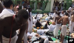 FILE - Muslim pilgrims gather around a group of victims of a stampede in Mina, Saudi Arabia, during the annual Hajj pilgrimage, Sept. 24, 2015. A total of 139 Indonisian nationals were killed in Hajj-related incidents that year.