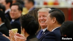 FILE - U.S. President Donald Trump and China's President Xi Jinping attend a state dinner at the Great Hall of the People in Beijing, Nov. 9, 2017.