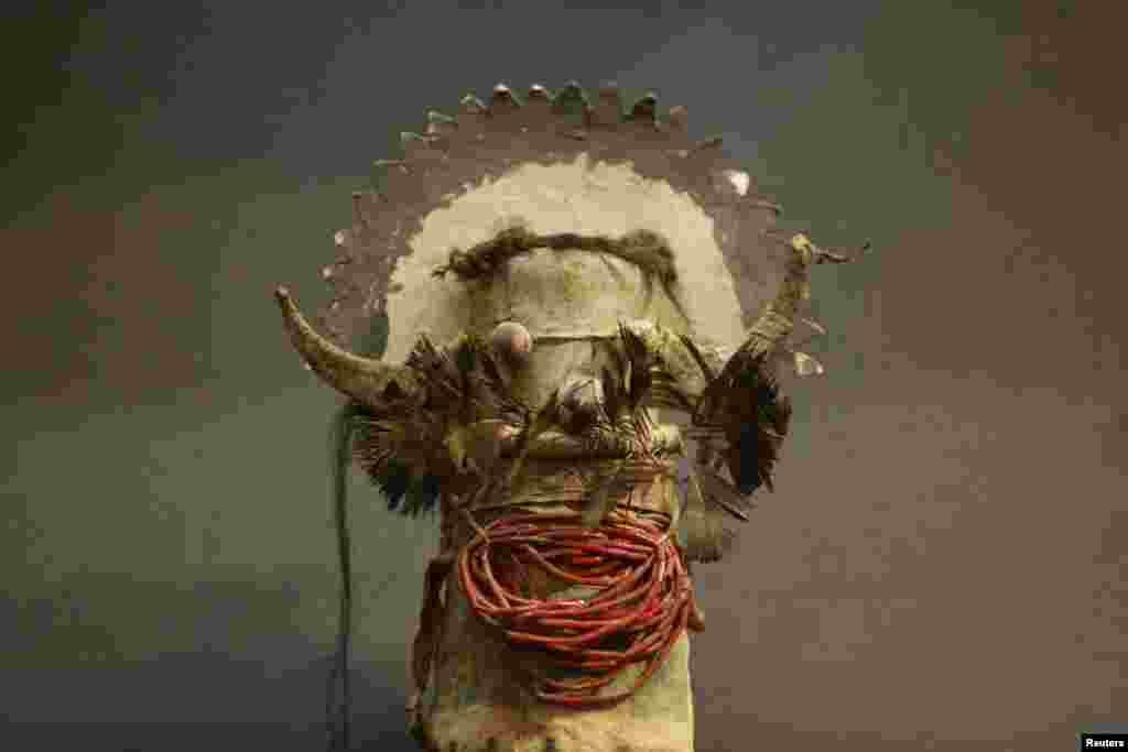 A rare antique doll, Katsina Shalako, circa 1880-1890, from the Native American Zuni tribe in New Mexico is displayed at the Drouot auction house in Paris, France, before it goes to auction.