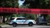 FILE - Police tape marks off a Chicago street as officers investigate the scene of a fatal shooting in the city's south side, June 15, 2021. 