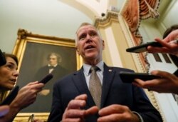 U.S. Senator Thom Tillis (R-NC) talks to reporters at the U.S. Capitol in Washington, January 30, 2020.