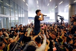 Pro-democracy activist Joshua Wong addresses the crowds outside the Legislative Council during a demonstration demanding Hong Kong's leaders to step down and withdraw the extradition bill, in Hong Kong, China, June 17, 2019.