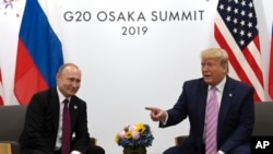 Президенти США та Росії перед переговорами у місті Осака в Японії в межах саміту "Великої двадцятки" 28 червня 2019 року 