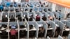 FILE - Workplaces have become high-stress spaces where many people feel overwhelmed, says Christine Porath, a Georgetown University management professor.