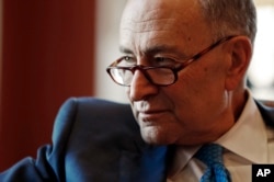 Senate Minority Leader-elect Chuck Schumer of New York, speaking to the AP at his Capitol Hill office, Nov. 18, 2016, says Jeff Sessions will face tough questions during confirmation hearings on his selection as attorney general.